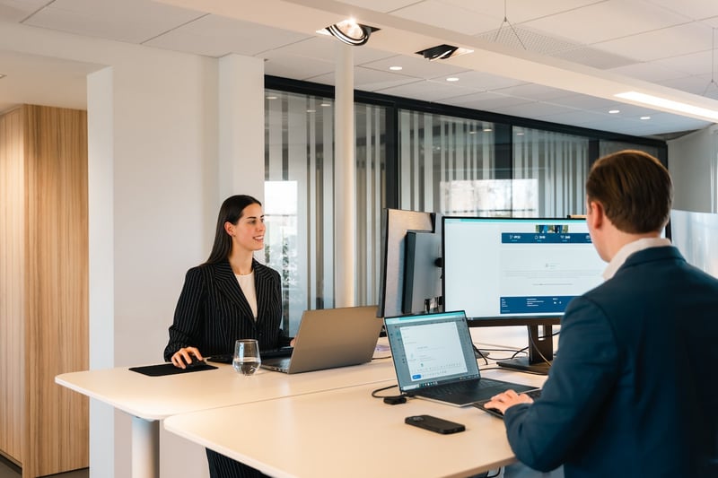 man-and-woman-working-together-in-desk-english-degree-jobs