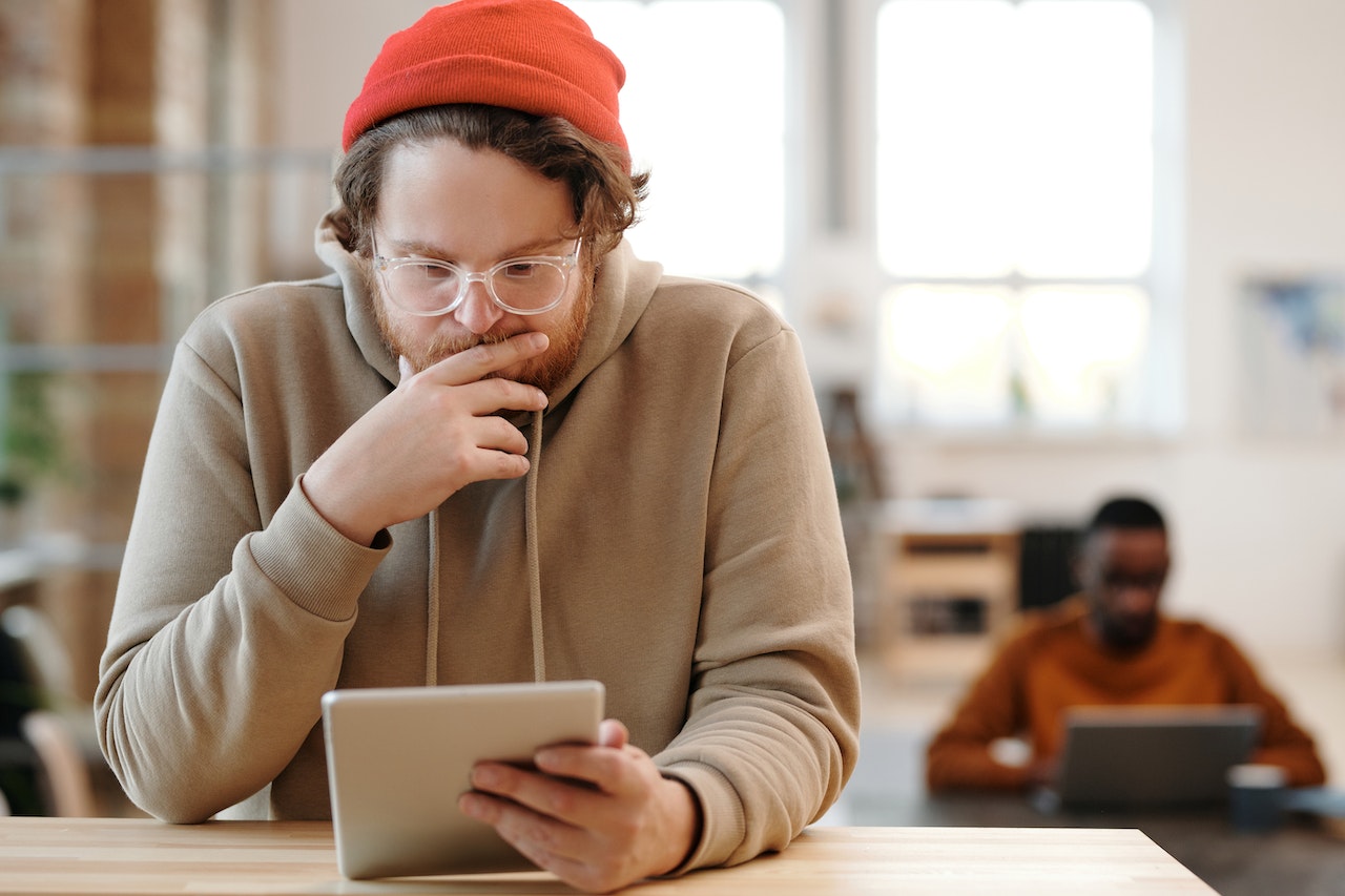 man-thinking-carefully-using-his-ipad-leaving-a-legacy