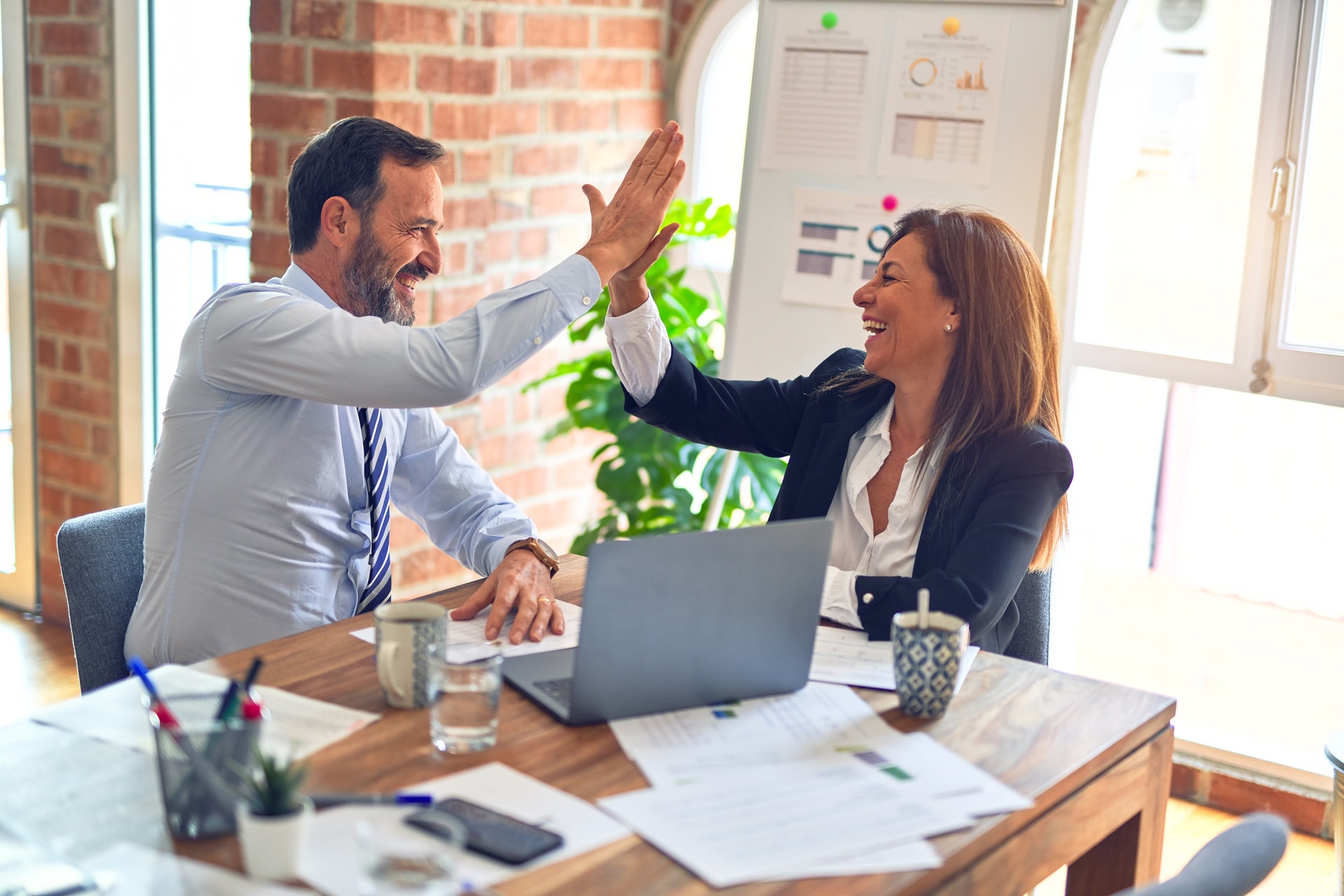 man-woman-high-five-performance-reviews