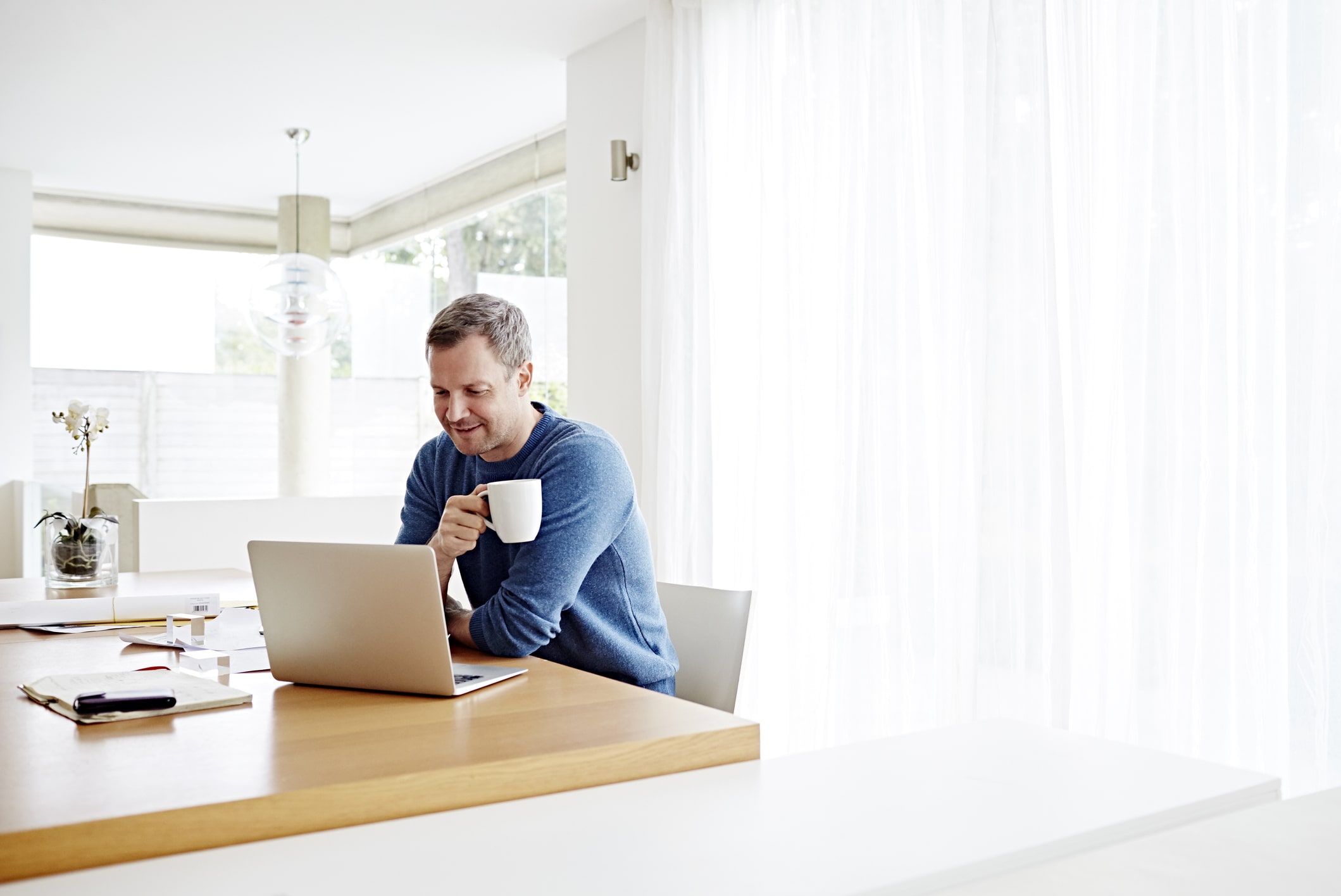 man-working-at-home-using-laptop-workaholics-vs-working-long-hours