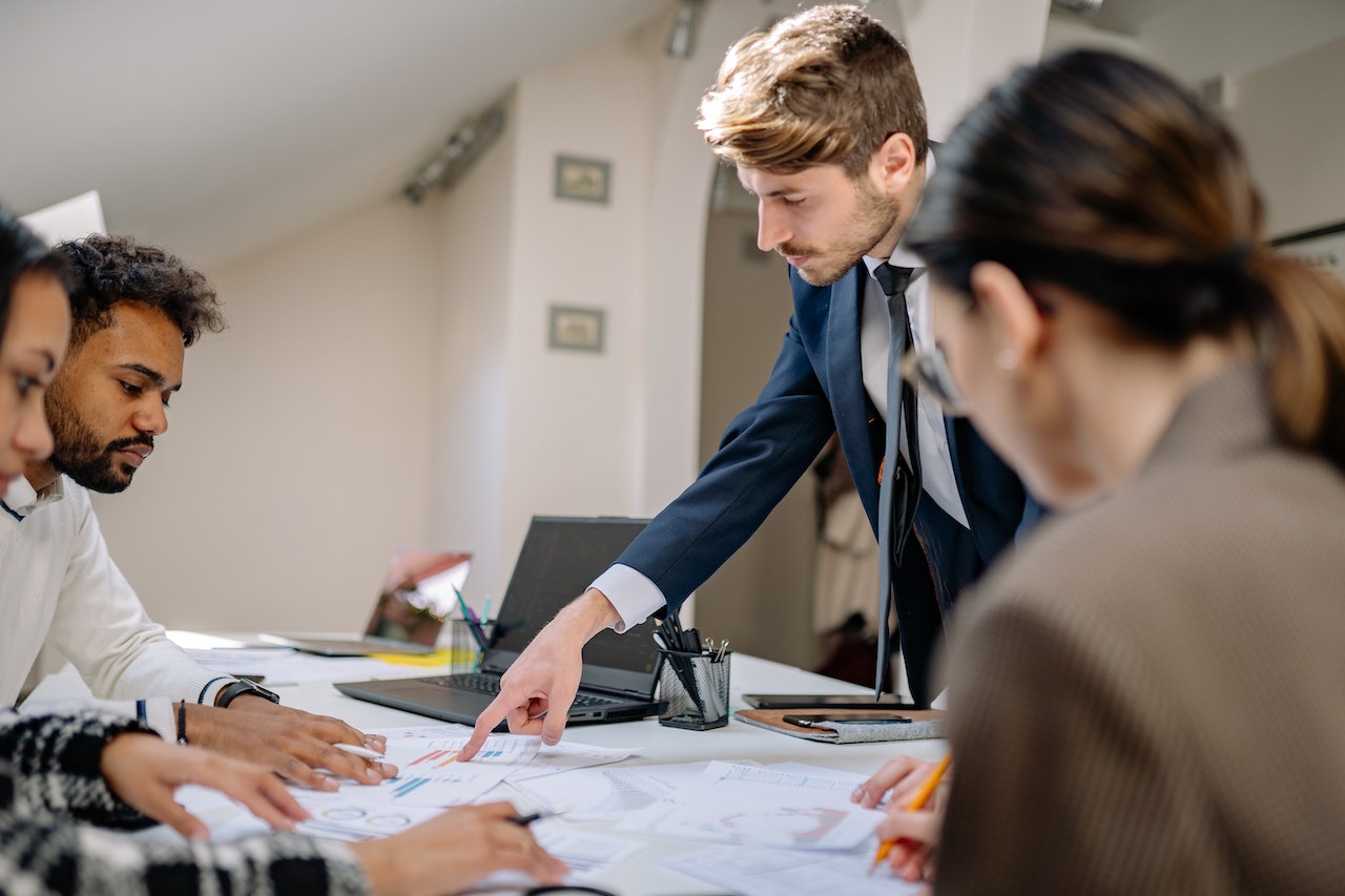 manager-organizing-tasks-for-employees-at-office-Eisenhower-Matrix