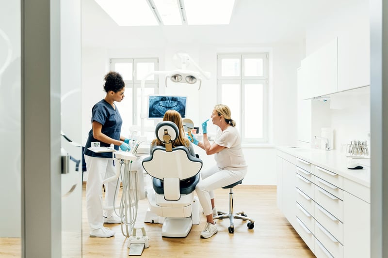 orthodontist-showing-patient-x-ray-best-careers-for-the-next-ten-years