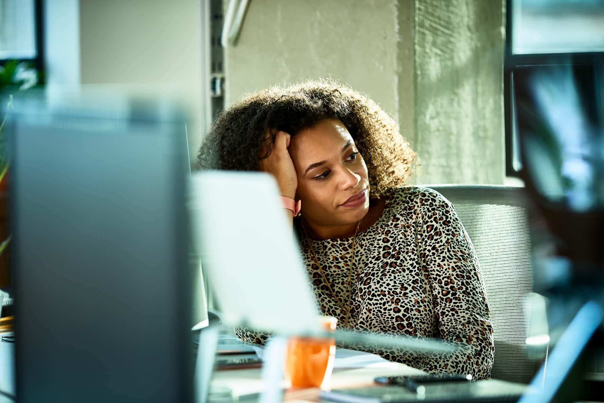 stressed-woman-at-her-desk-benefits-of-eustress