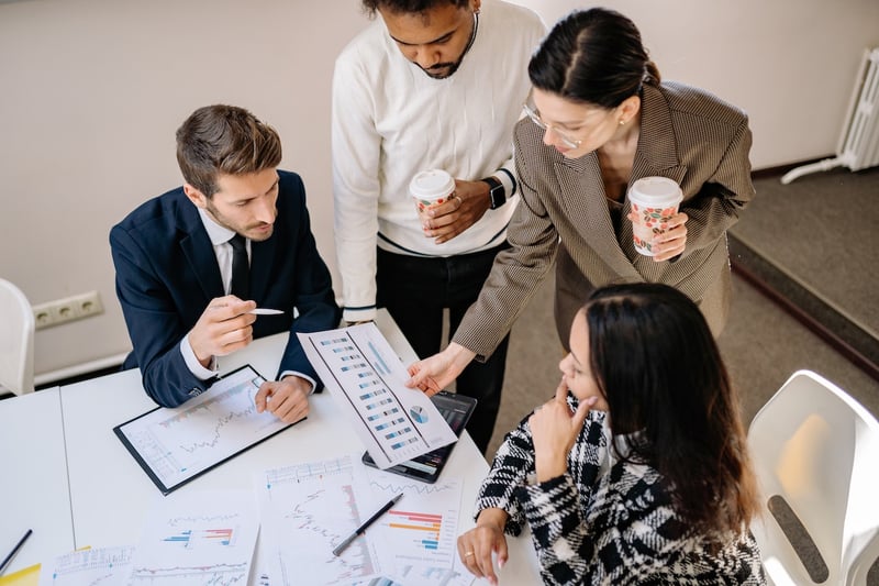 team-discussing-some-papers-benefits-of-collaboration