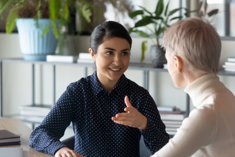 two-colleagues-talking-in-the-office-how-to-talk-to-your-boss-about-mental-health