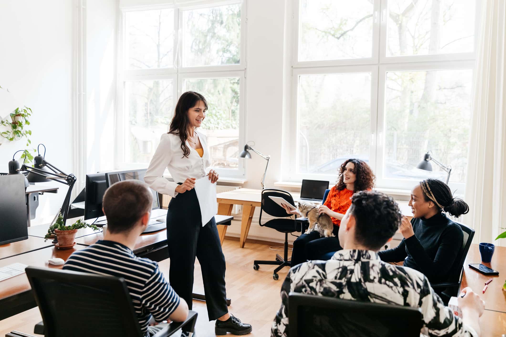 woman-addressing-colleagues-during-business-meeting-examples-of-eustress