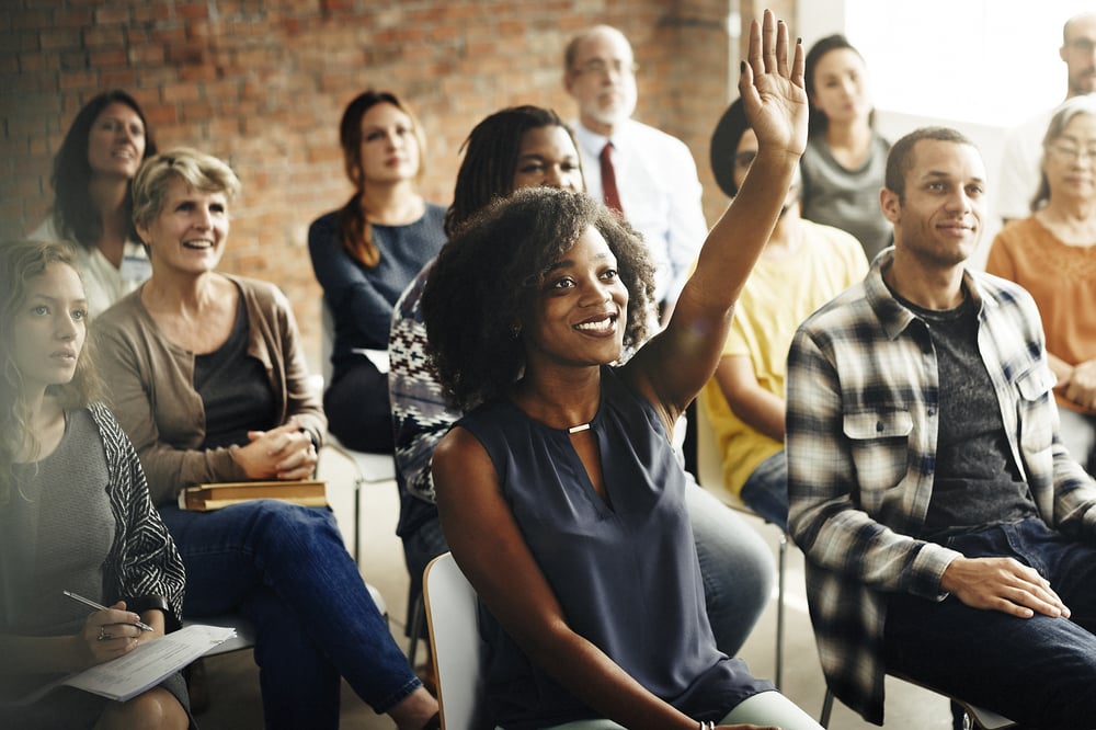 woman-asking-questions-during-meeting-self-awareness-in-the-workplace