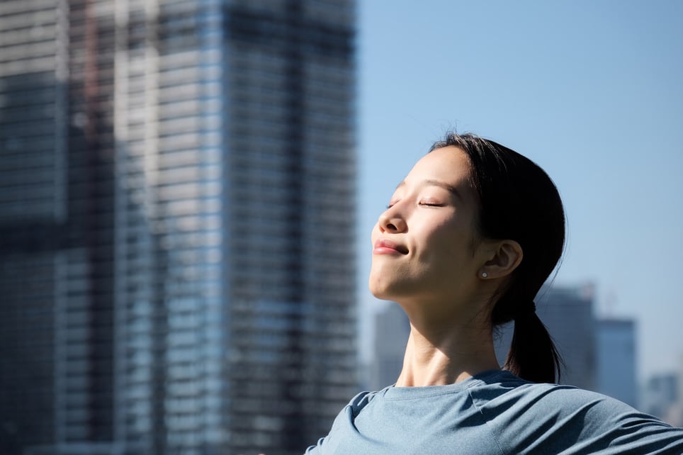 woman-doing-relaxation-exercise-in-office-resilient-mindset