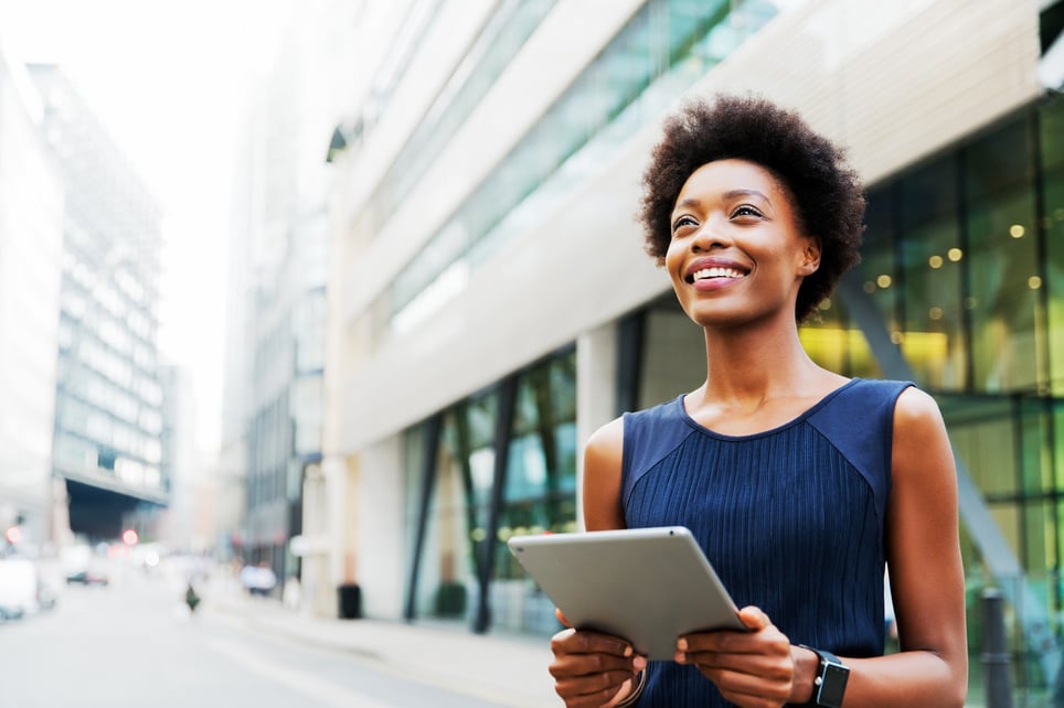 woman-looking-up-with-tablet