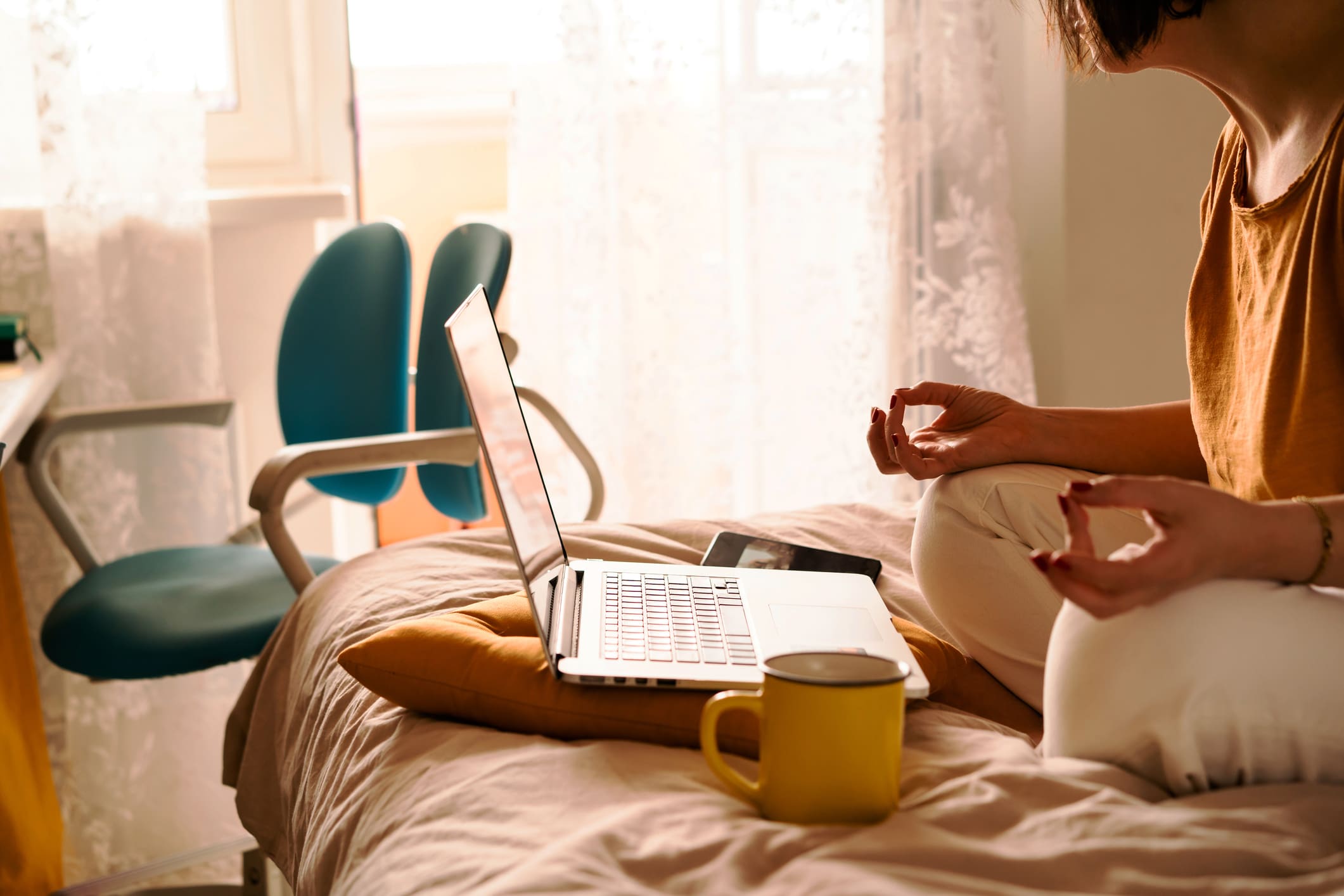 woman-meditating-with-her-laptop-what-is-guided-imagery-for-stress