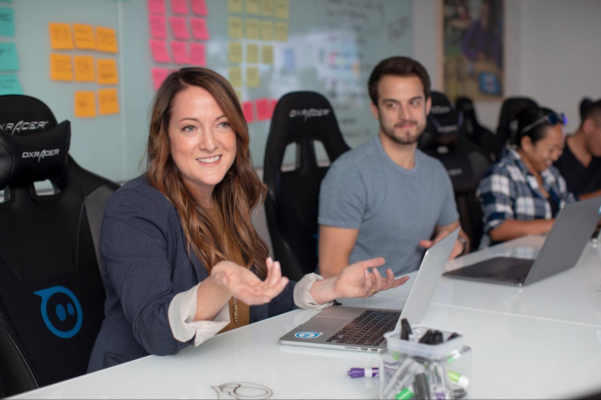 woman-sitting-in-meeting-smiling-executive-development