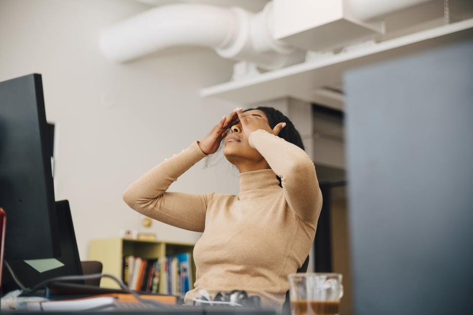 woman-stressed-in-office-millenials-and-burnout