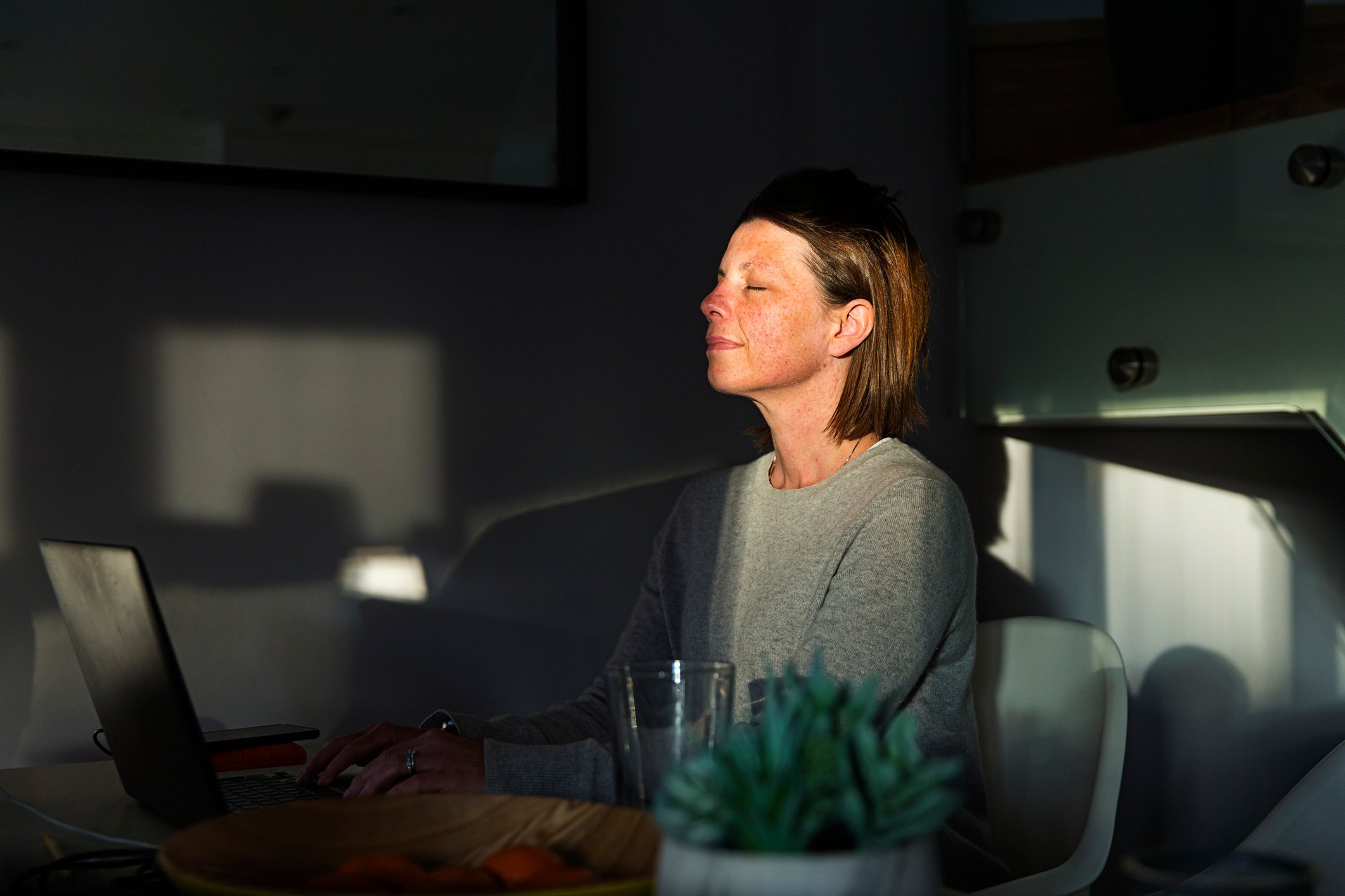 woman-taking-a-breath-while-working-expressing-emotions