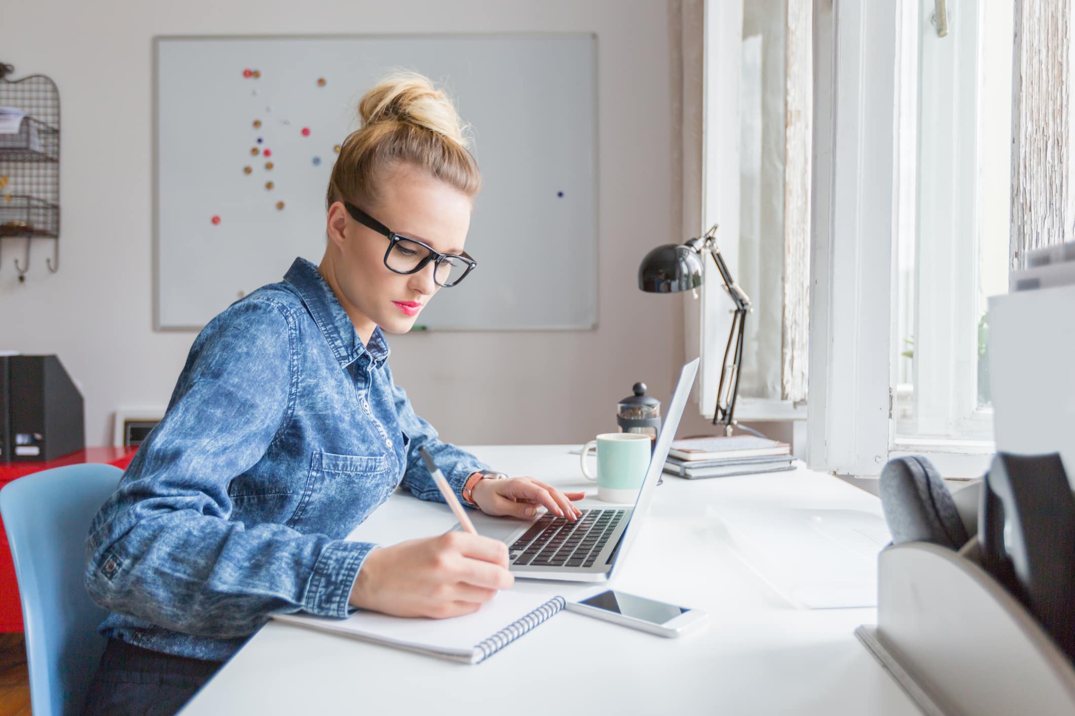 woman-working-in-modern-office-as-a-creative-how-to-start-an-email