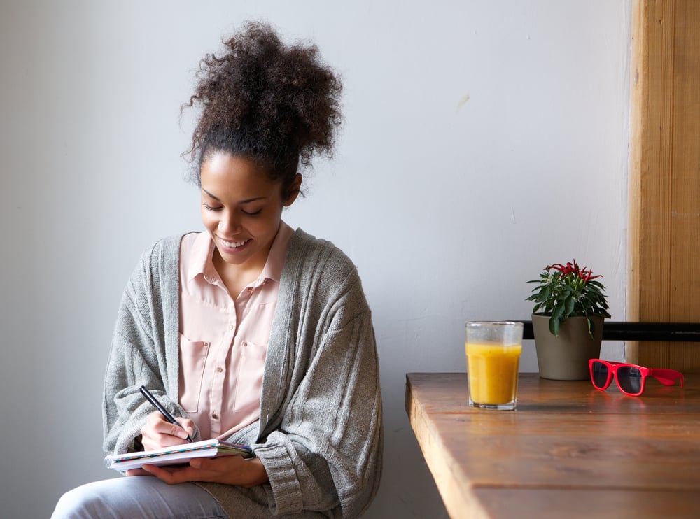 woman-writing-on-a-agenda-what-is-an-action-plan