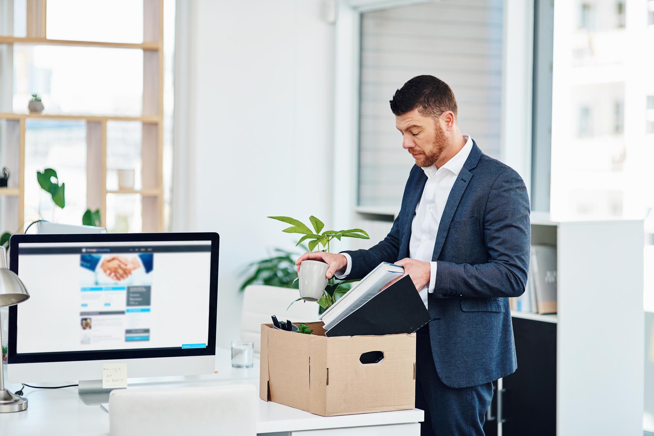 young-businessman-packing-up-his-desk-at-work-after-quitting-signs-you-are-being-pushed-out-of-your-job